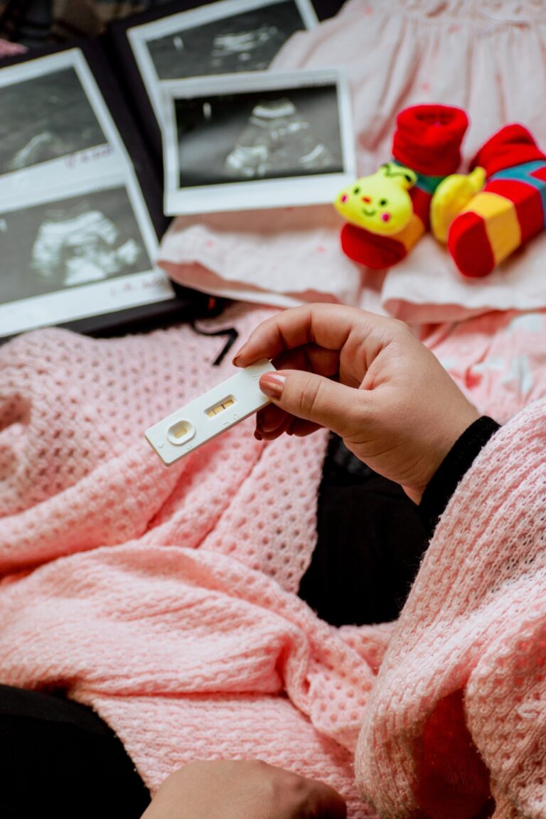 woman holding pregnancy test