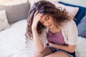 Woman holding waist while in pain