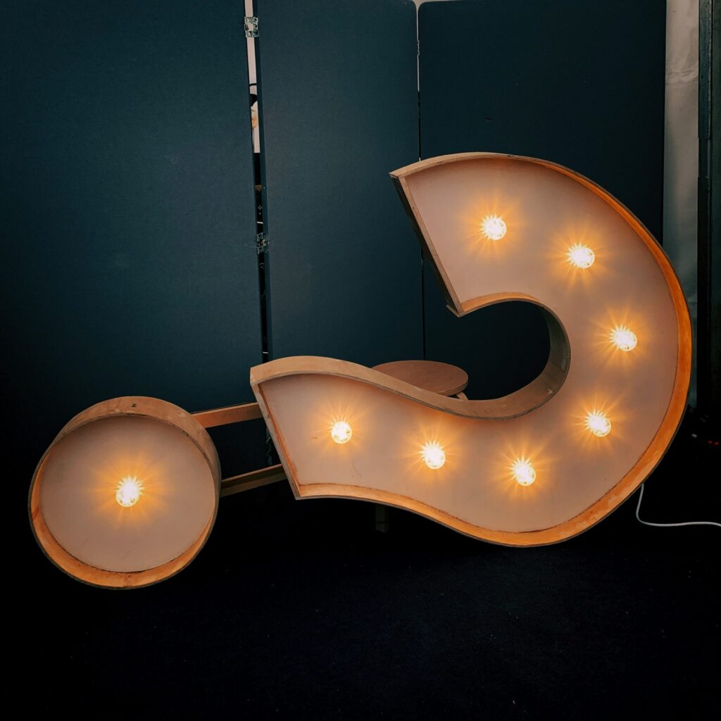 a large lit up question mark